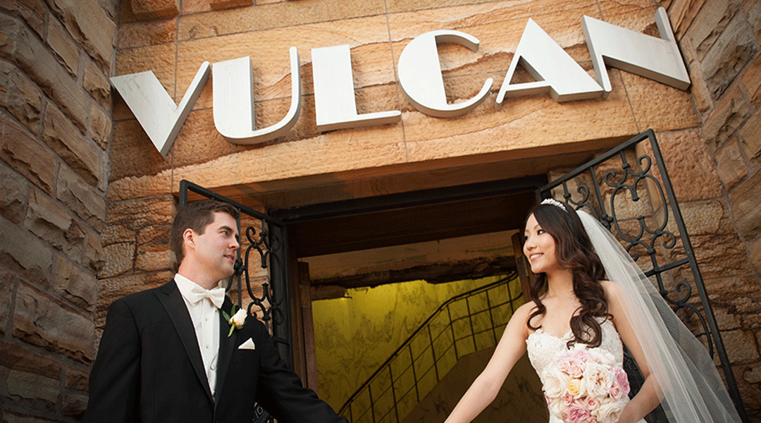 Wedding couple outside of the vulcan entrance